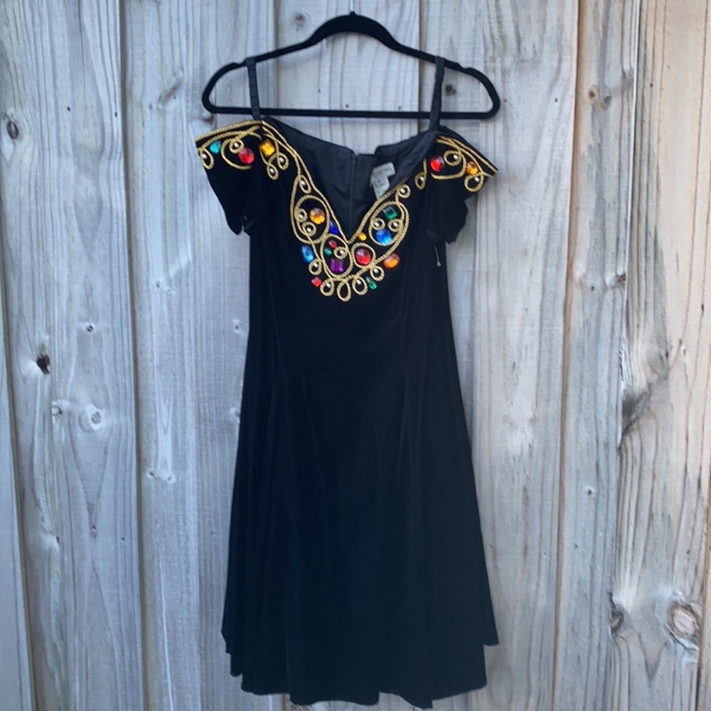 Henri Bendel BlackVelvet dress with jewels at neck line.